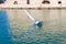 Maneuvering a laser sailing boat during sailing exercise in Heraklion venetian port, Crete, Greece