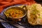 Mangalorean style roasted cauliflower and spinach curry with basmati rice and garlic naan bread, tasty vegetarian food