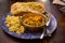 Mangalorean style roasted cauliflower and spinach curry with basmati rice and garlic naan bread, tasty vegetarian food