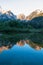 Mangart - Morning sunrise view of Superior Fusine Lake (Laghi di Fusine) with majestic Mount Mangart