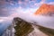 Mangart Mountains Peak above Clouds at Dramatic Sunset in Julian Alps