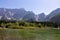 Mangart - Panoramic view of Superior Fusine alpine Lake (Laghi di Fusine) with majestic Mount Mangart