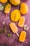 Mango banana popsicles with fresh fruits, flat lay top view