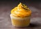 A mango cupcake with a blur background