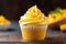 A mango cupcake with a blur background