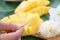 Mango flesh yellow in hand and sticky rice.