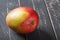 Mango fresh fruit on black wooden table