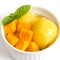 Mango icecream in a white bowl on white background.