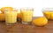 Mango milkshake in glass made with yellow baby Mangos with white background