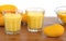 Mango milkshake in glass made with yellow baby Mangos with white background