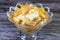 Mango pieces fillings inside Sweet Koshary recipe in Egypt made of multi layers of rice with milk sweet pudding, whipped cream,