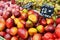 Mango and plums on market stand