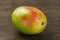 Mango ripe fresh red green yellow natural vitamins tropical life on wood