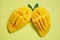 Mango slice and mango leaves from tree tropical summer fruit concept - Sweet ripe mangos cut half