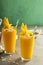 Mango smoothie with honey and coconut