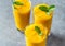 mango smoothie in tall glasses