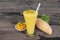 Mango smoothies yellow colorful fruit juice milkshake blend beverage healthy high .