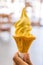 Mango soft cream in waffle cone