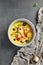 Mango soup with fresh berries and fruits. Asian dessert food on dark slate background. Chinese, asian, authentic food concept