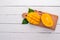 Mango. Tropical Fruits. On a wooden background.