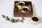 Mango wood wooden tray with four espresso coffee cups. Empty space
