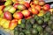 Mangoes and avocados at a market stall