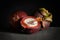 Mangosteen fruit, half, whole on dark wooden background