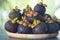 Mangosteen fruit in wooden dish on wood table