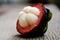 Mangosteen, group of Mangosteens on wooden table