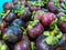 mangosteen, manggu or mangosteen, at a traditional fruit market in the city of jakarta indonesia