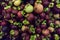 Mangosteen. A pile of mangosteen selling in a market, mangosteen background