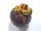 Mangosteen. A tropical fruit with sweet juicy white segments of flesh inside a thick reddish-brown rind.