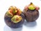 Mangosteen. A tropical fruit with sweet juicy white segments of flesh inside a thick reddish-brown rind.