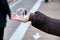 MANHATTAN, NY - DECEMBER 6th, 2018: Transparent ball in a woman\'s hand with Brooklyn Bridge reflections