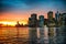 Manhattan skyline panorama with beautiful orange sunlight from the water