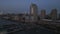 Manhattan view from above at sunset. Forwards fly above street between modern buildings. Day in Manhattan, NYC aerial