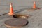 Manhole cover open in street and repair of roads. Accident with sewer hatch in city. Concept of repair of sewage, underground