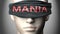 Mania can make things harder to see or makes us blind to the reality - pictured as word Mania on a blindfold to symbolize denial
