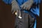 maniac in gloves hold sharp knife behind his back and in pocket is bolated