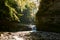 Maniavskyi waterfall in Maniava, Cascade in forest in mountains. Carpathian Mountains, Ivano-Frankivska oblast, Ukraine