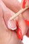 Manicure applying - cleaning the cuticles