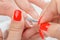 Manicure applying - cleaning the cuticles
