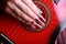 Manicure on background guitar