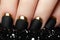 Manicure. Black matte nail polish. Manicured nail with black mat