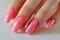 Manicure closeup. Woman pink nails close-up. Nail care in beauty salon. Spa healthy treatments for female hands. Fashion bright
