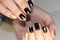 Manicure design black and gold color