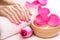 Manicure with fragrant rose petals and towel. Spa