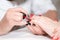 Manicure. Master applies varnish drawing on nails gel in spa . Closeup finger nail care by specialist in beauty salon.