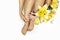 Manicure and pedicure at a long oval shaped nails with yellow lilies