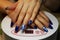 manicure performed by the student. the hands lies on a special ultraviolet lamp. Blue finish with a painted white zipper.